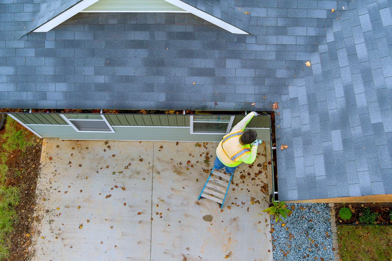 Ladder set against a Nashville home for gutter cleaning